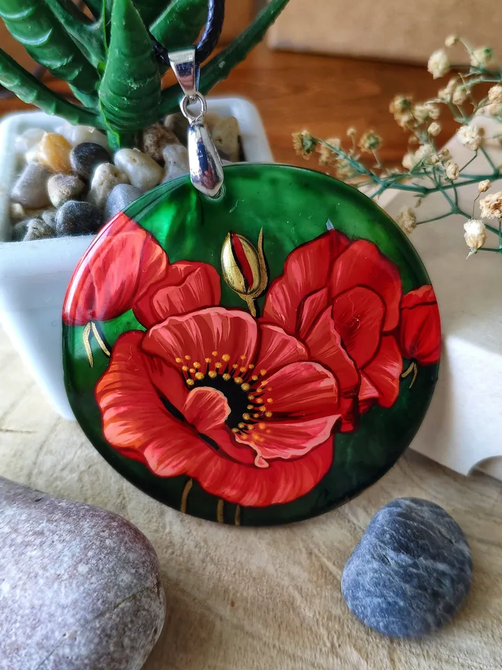 Floral Symphony: Captivating Red Poppy on Iridescent Green Nacre Pendant, a Stunning Blend of Nature and Artistry, Icon of Love and Passion