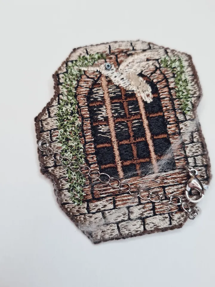 Machine embroidery design for art therapy: Brooch " Window of the old castle"