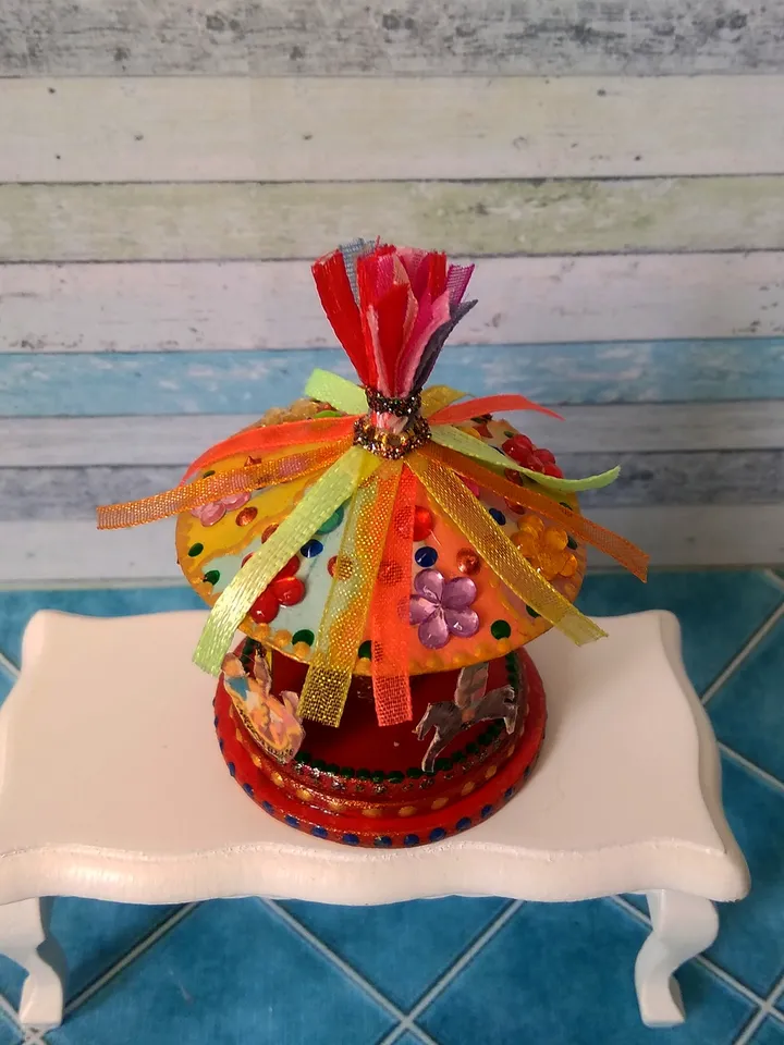 Miniature carousel. Dollhouse miniature.1:12 scale.