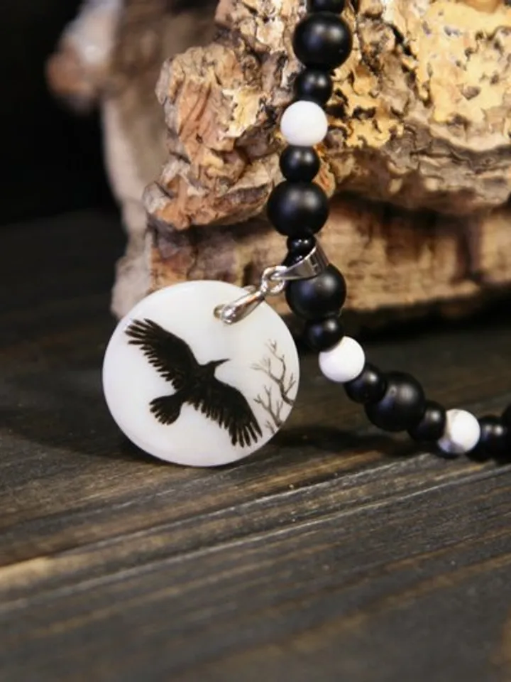 Raven or crow necklace with love rune on the other side. Nacre pearl pendant