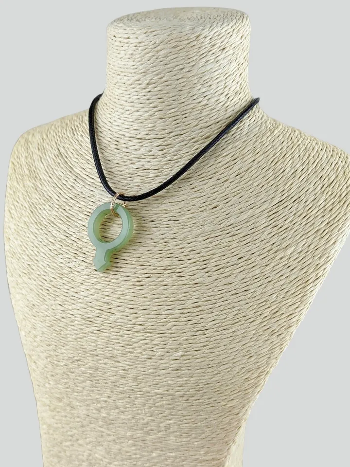 Green jade pendant gender male sign symbol of Mars LGBTQ.