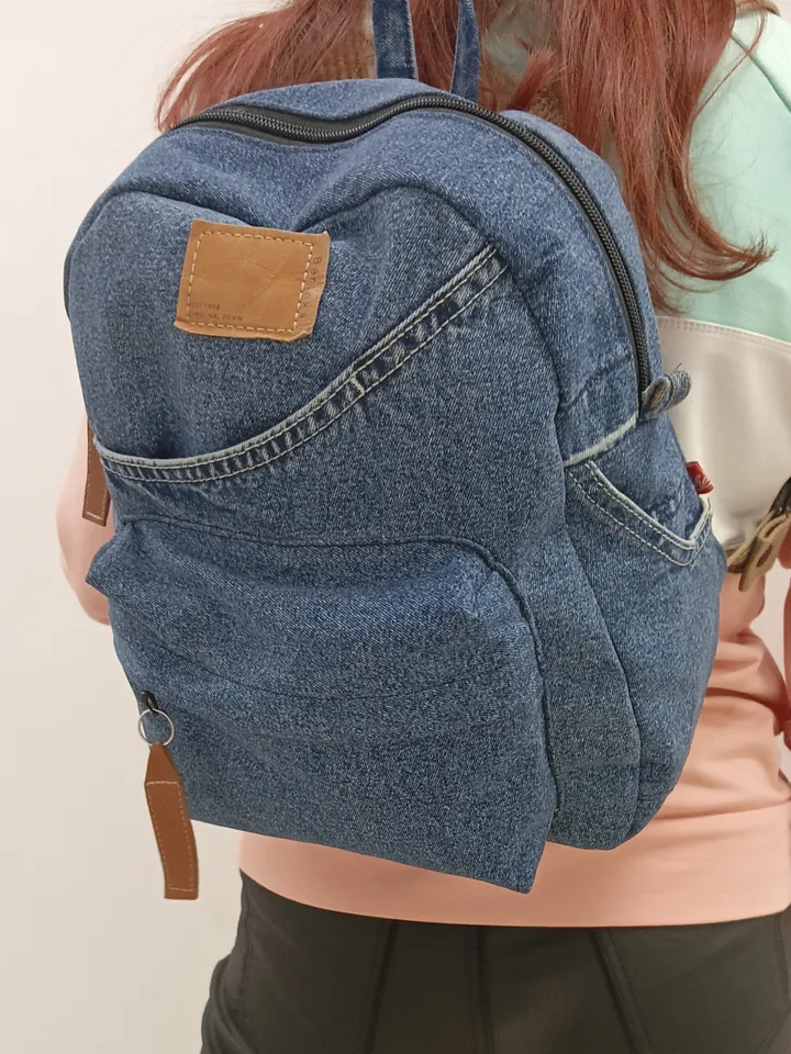 Stylish Denim backpack with 100 percent cotton lining, handmade, jeans recycling, 6 pockets.