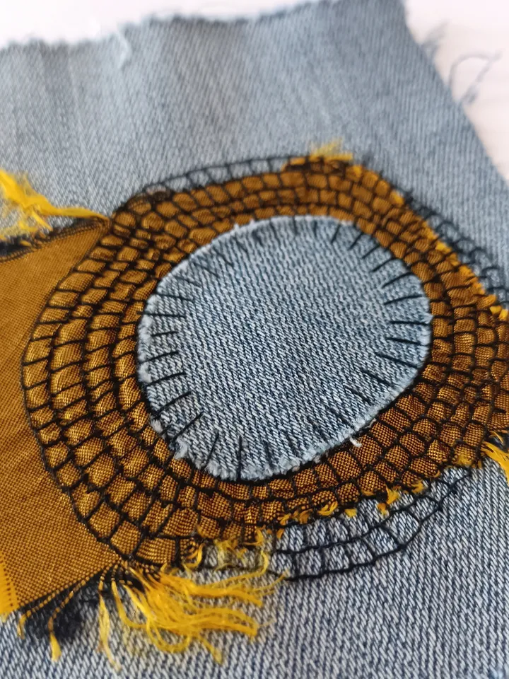 Upcycled denim boro patch. Sashiko stitching.
