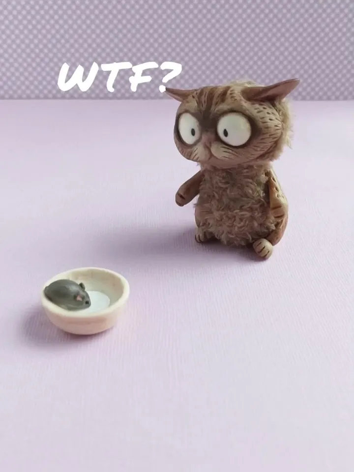 Discouraged cat doll