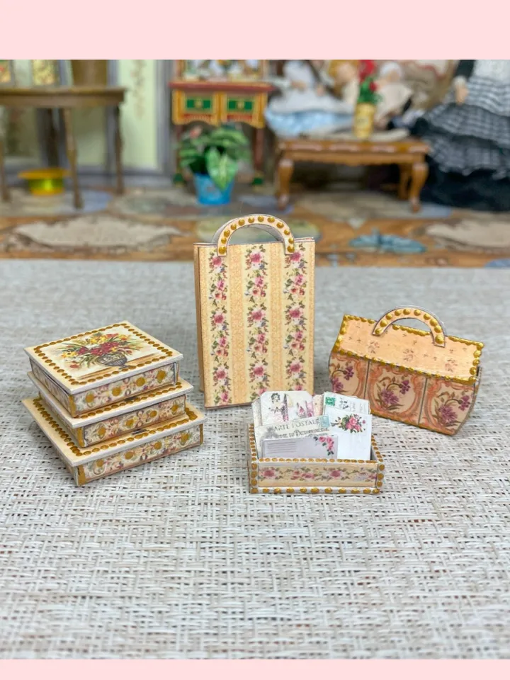 A set of accessories in beige and pink to fill the interior of a dollhouse in 1:12 scale.