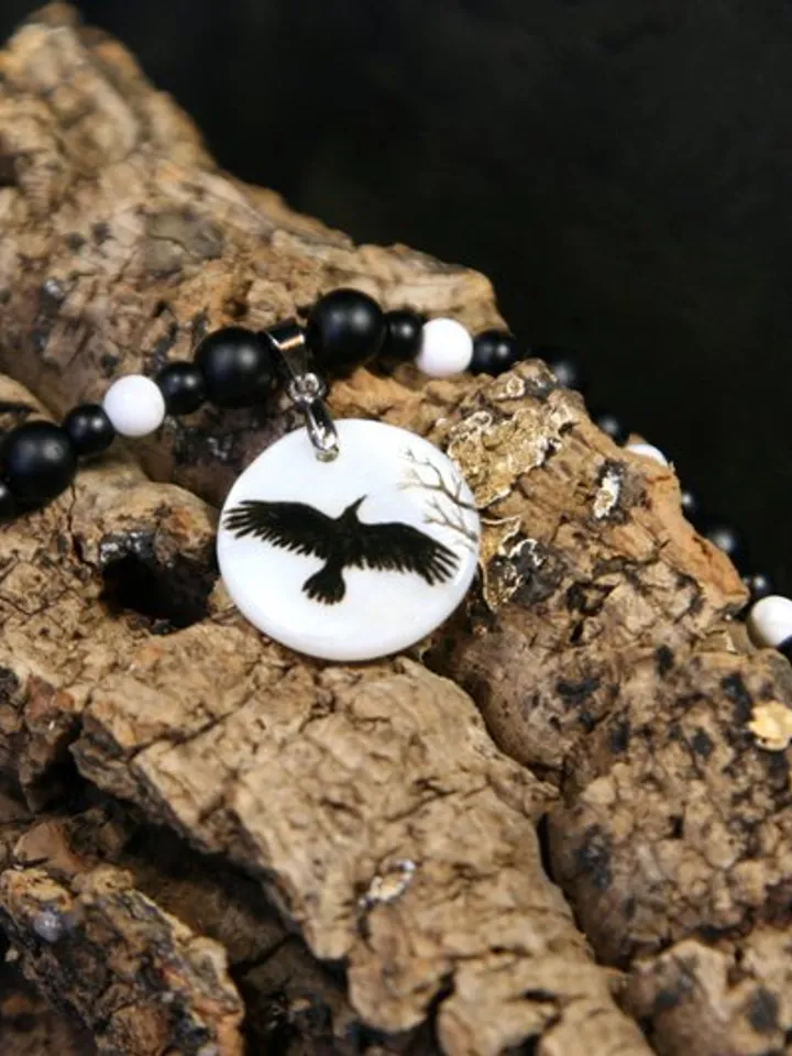 Raven or crow necklace with love rune on the other side. Nacre pearl pendant
