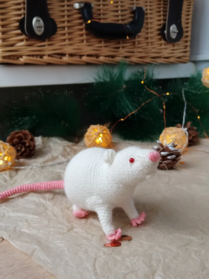 White mouse toy. Soft toy life-size white rat with red eyes.