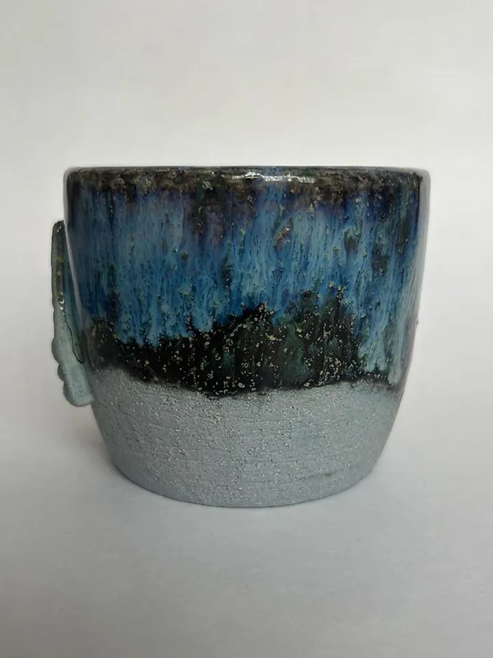 Trinity knot Triquetra in circle blue clay and black galaxy glazed stoneware mug