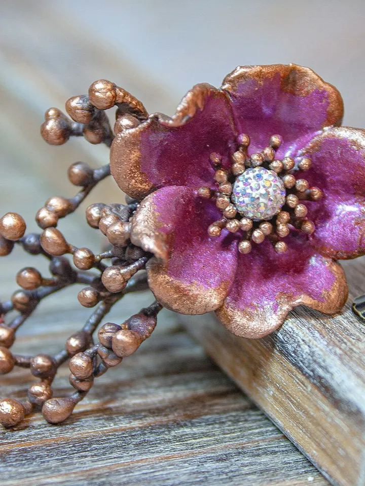 Unique handmade copper ring made from a real flower bud using the electroforming method, decorated with a Swarovski crystal