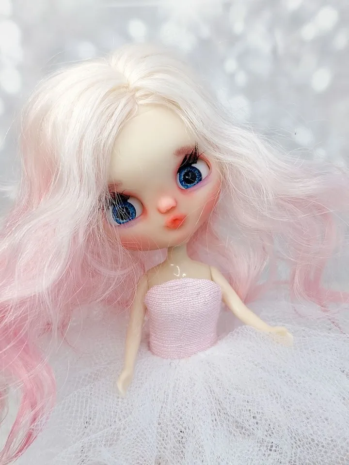 Petite Blythe doll with pink hair. Small doll with eye mechanism. Doll with a kiss.