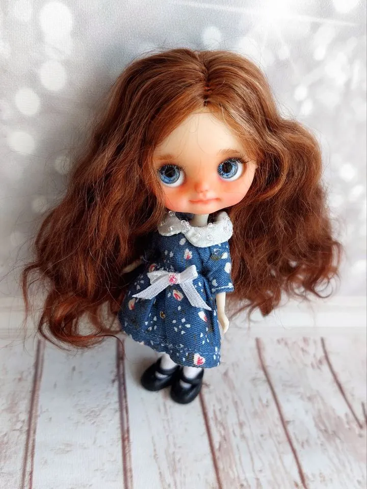 Charming little girl with brown hair and blue eyes. Author's miniature doll for your collection.