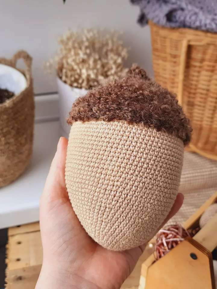 Stuffed biege acorn toy for Home decor. Acorn in Scandinavian style. Decoration of apartments and houses. Universal gift