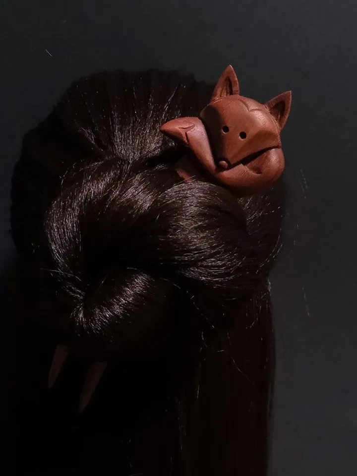 Carved wooden hairpin with a fox.