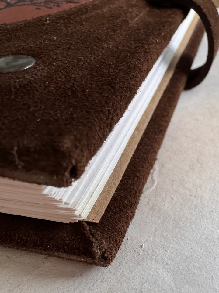 Notebook made of genuine suede with leather insert and wood engraving.
