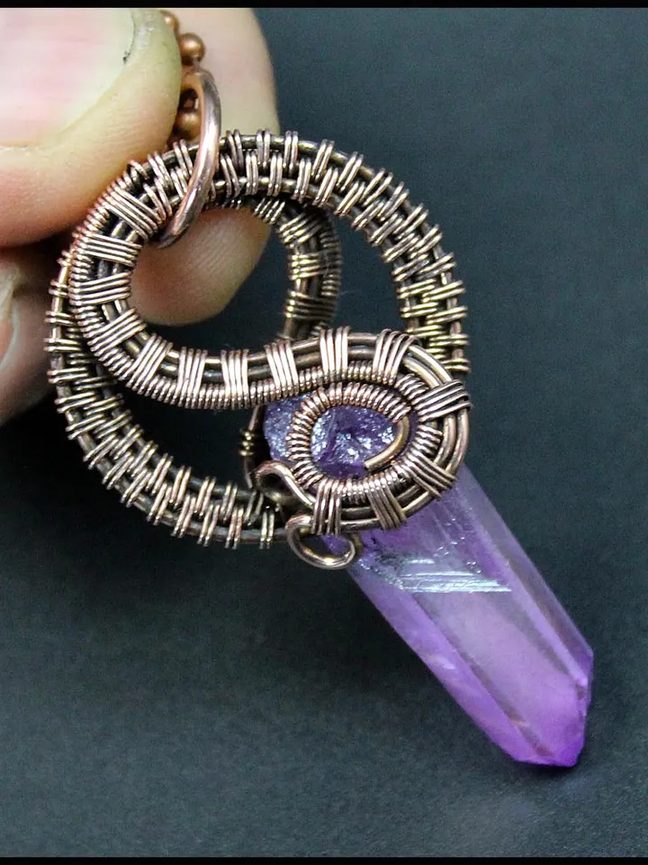 Handmade copper wire pendant with quartz crystal.