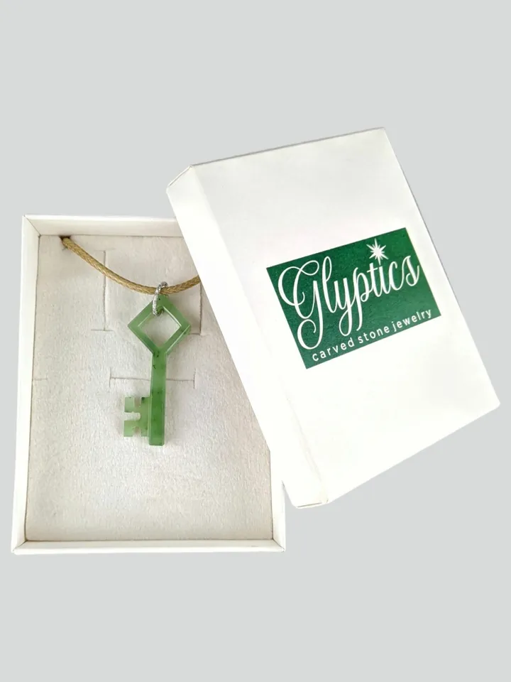 Skeleton green jade key good luck charm pendant.