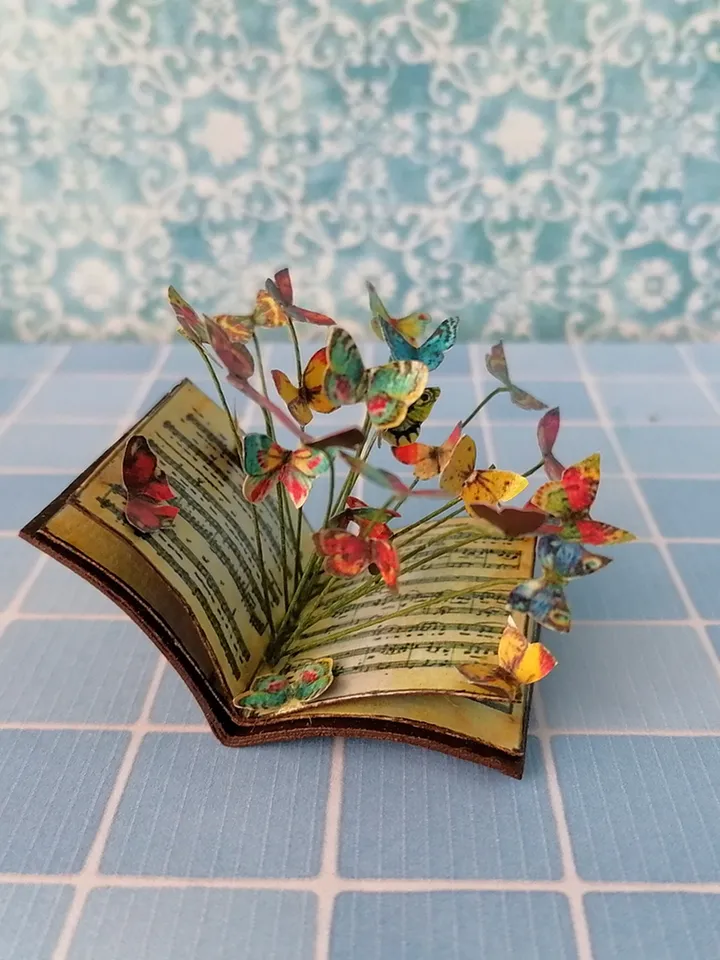 Miniature book with flying butterflies.1:12 scale.