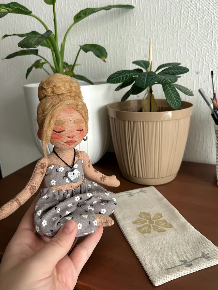 Textile doll yoga girl with blonde bun and tattoo