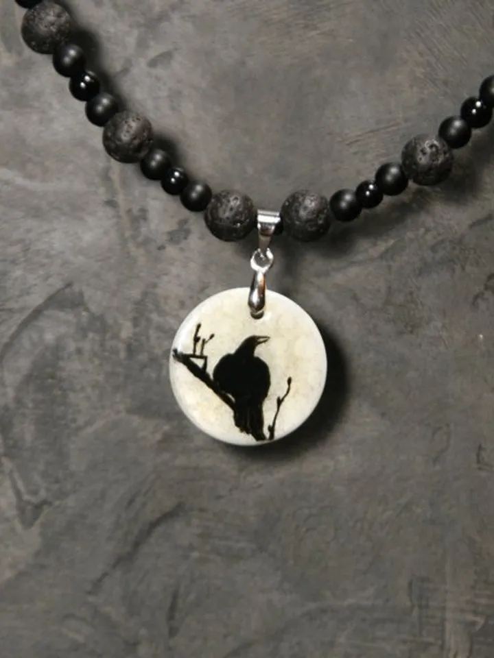Raven or crow necklace with love rune on the other side. Nacre pearl pendant