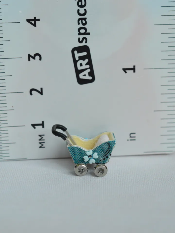 Miniature doll stroller. 1:48 scale. Dollhouse toy. Baby stroller.