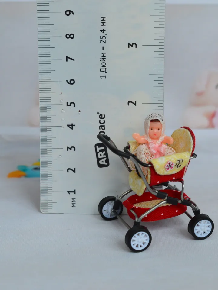 Miniature toy doll stroller in 1/24 scale. Complete with baby doll. Red handmade stroller.