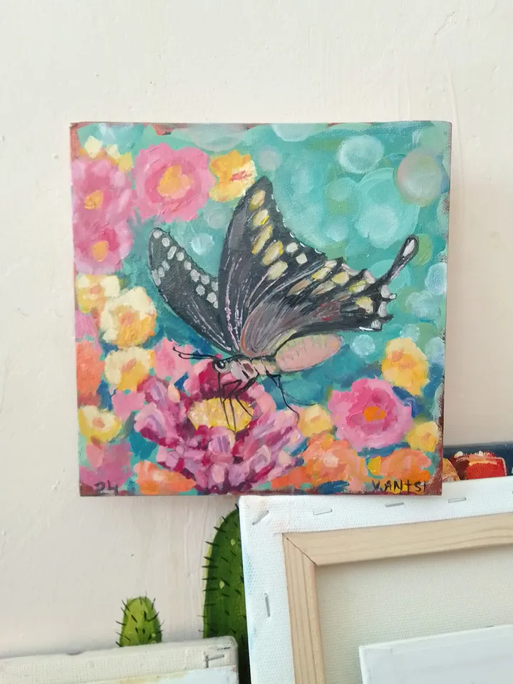 Painting flowers with a butterfly naif art bokeh
