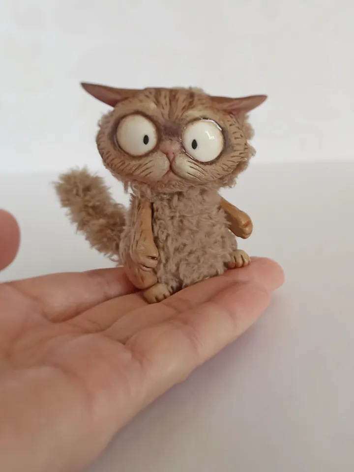 Discouraged cat doll