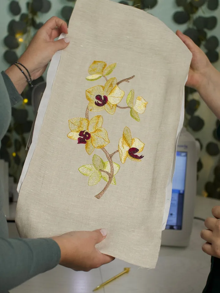 Orchid machine embroidery design using artistic satin stitch technique