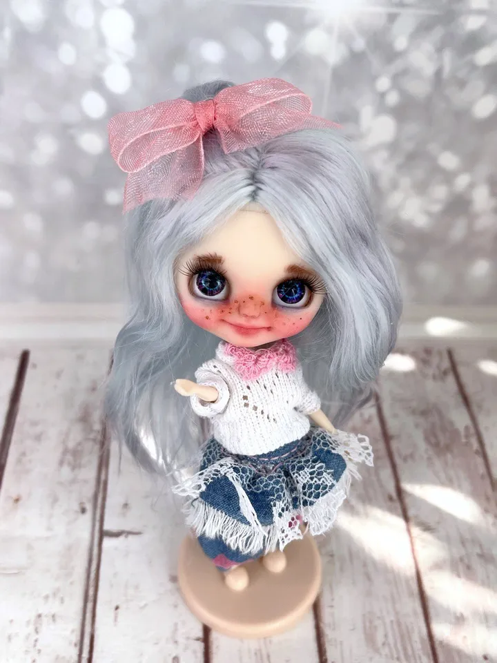 Small Blythe doll with blue eyes. Beautiful miniature Blythe doll with blue hair.