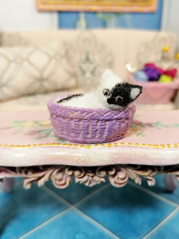 Cat in a basket. Dollhouse miniature.