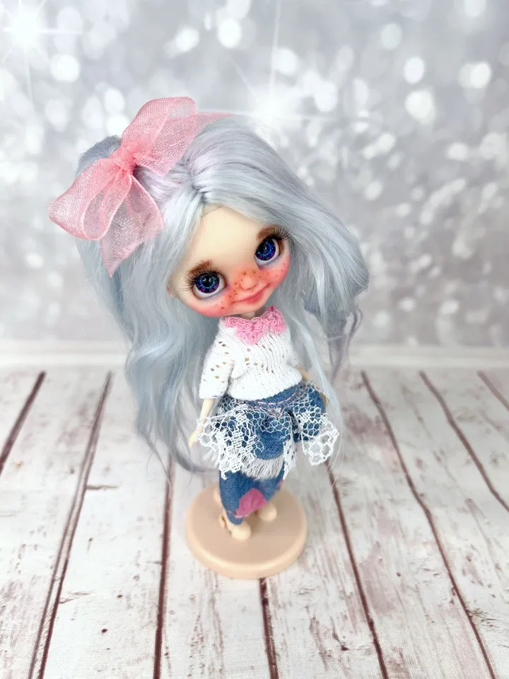 Small Blythe doll with blue eyes. Beautiful miniature Blythe doll with blue hair.