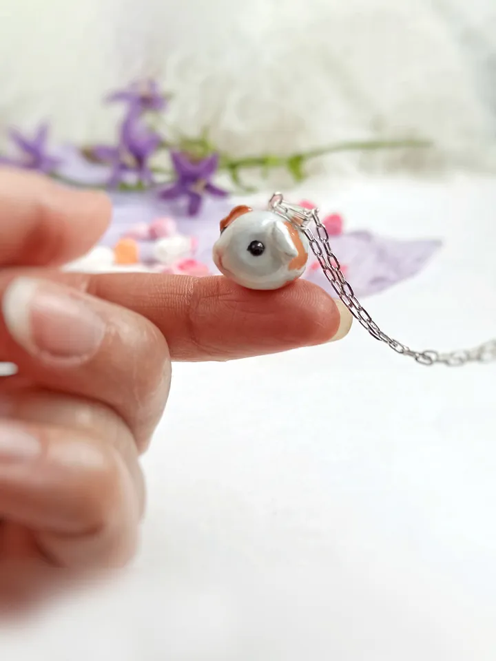 a Cute Guinea pig ball necklace in random color  (US discount)