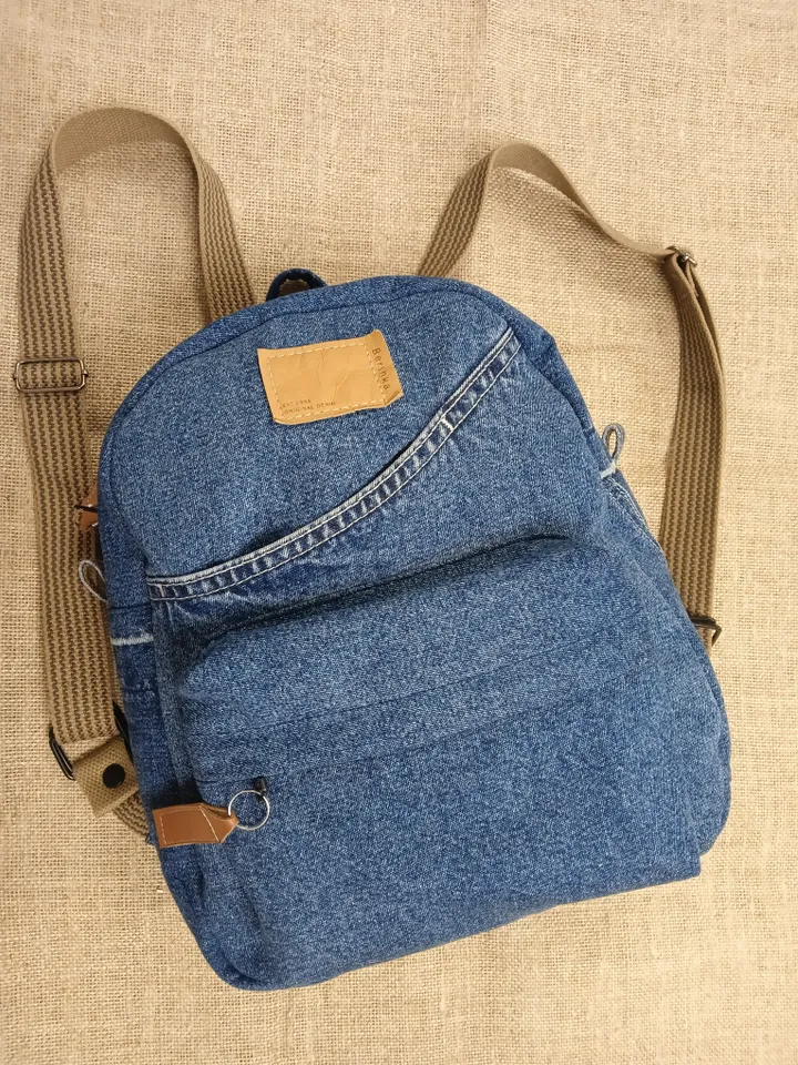 Stylish Denim backpack with 100 percent cotton lining, handmade, jeans recycling, 6 pockets.