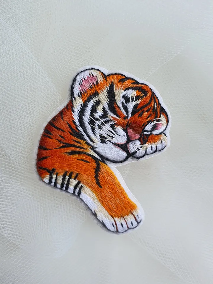 Sleeping Tiger Cub Brooch. Hand-embroidered with satin stitch
