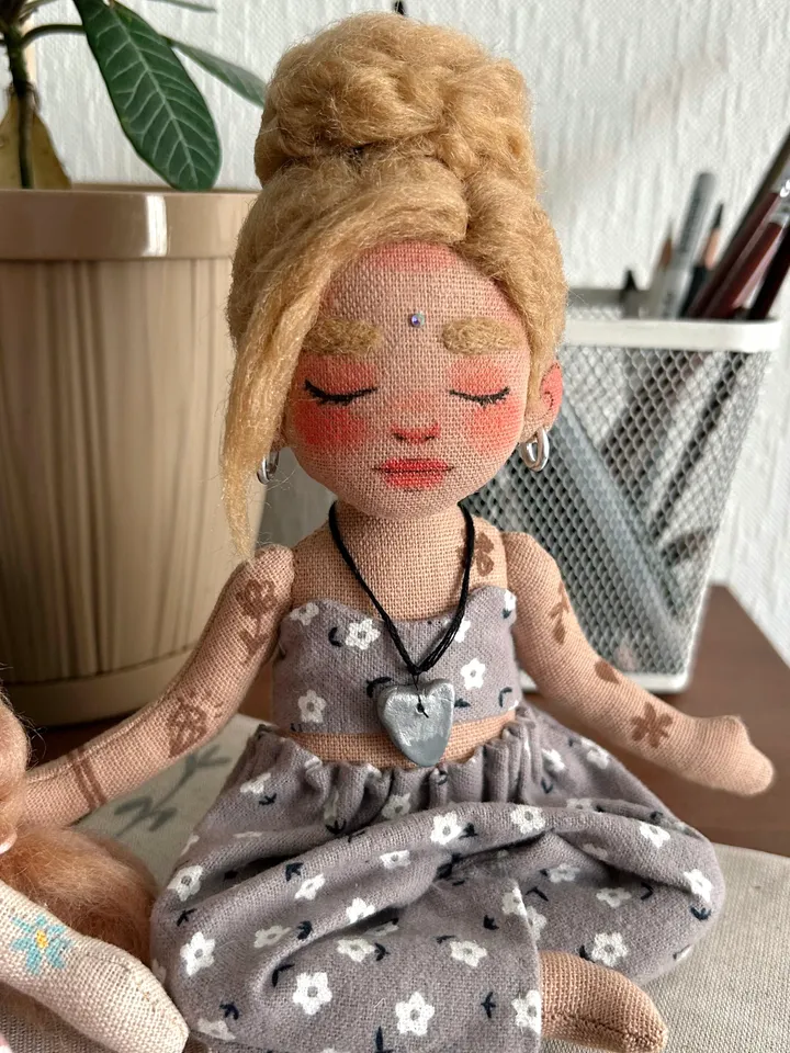 Textile doll yoga girl with blonde bun and tattoo