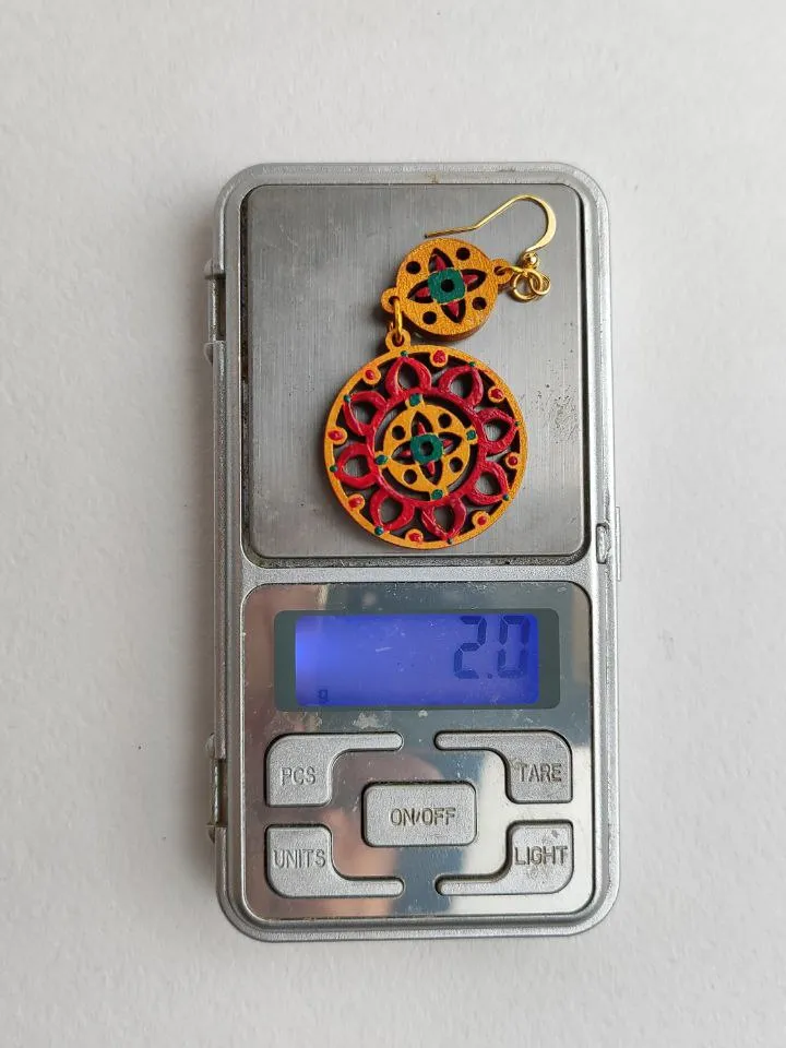 Bright ethnic earrings with hand painting