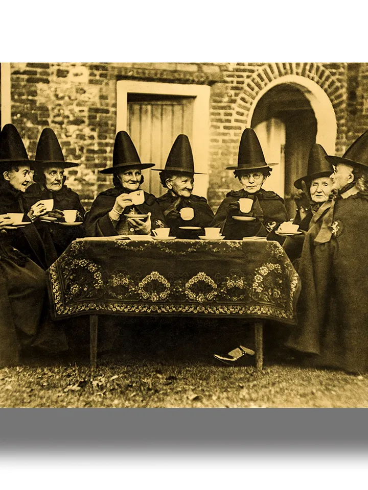 Witches tea party. Victorian photograph with a coven of witches.