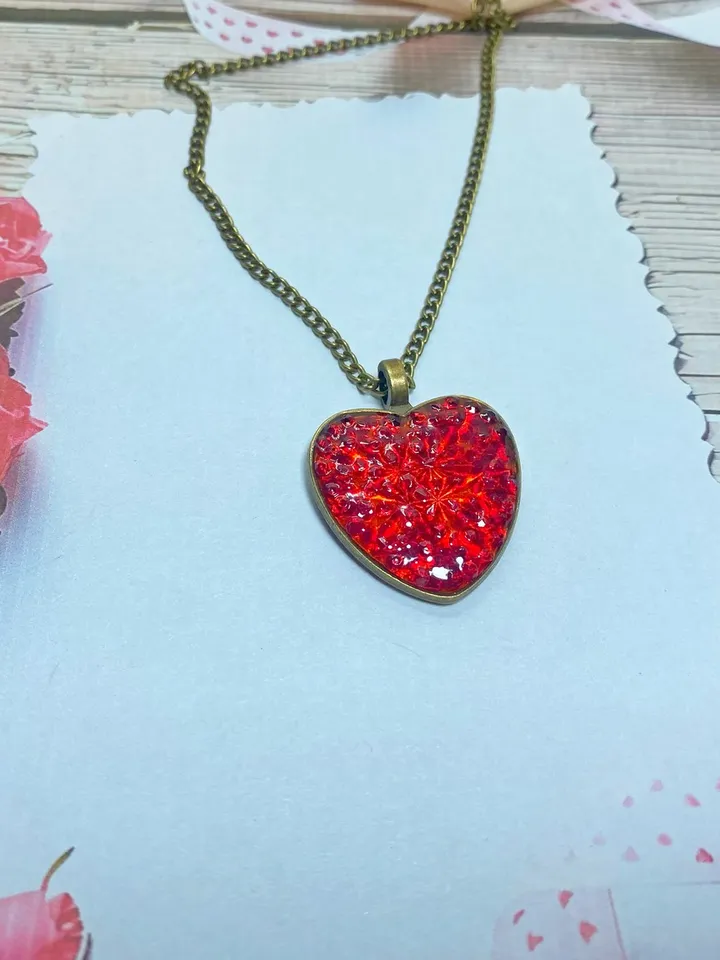 Pendant on a cord. Red heart. Handmade jewelry.3D effect.