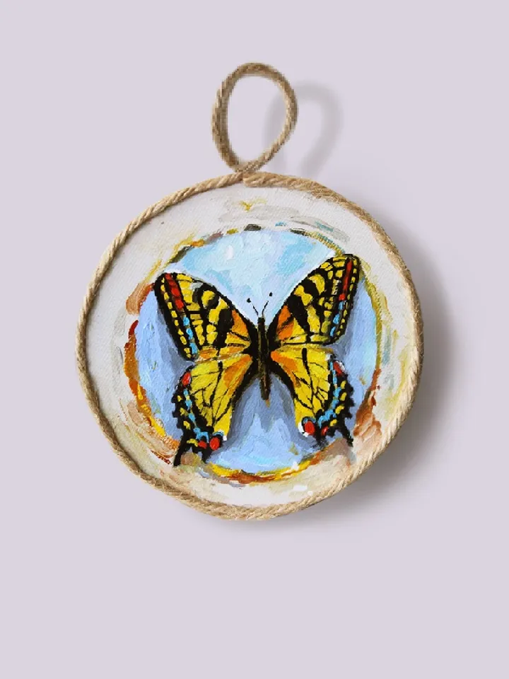 Butterfly medallions painted with oil paints on quartz vinyl, with a loop to hang. 3 pieces.