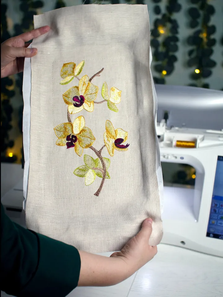 Orchid machine embroidery design using artistic satin stitch technique