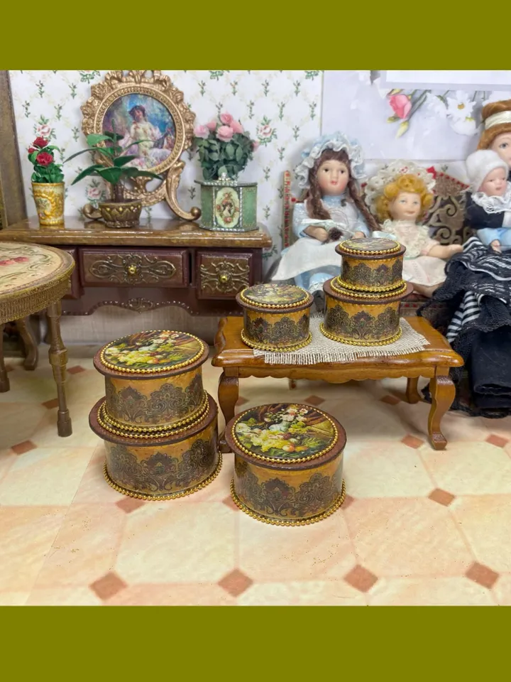 A set of handmade miniature boxes for filling the interior of a dollhouse in 1:12 scale.