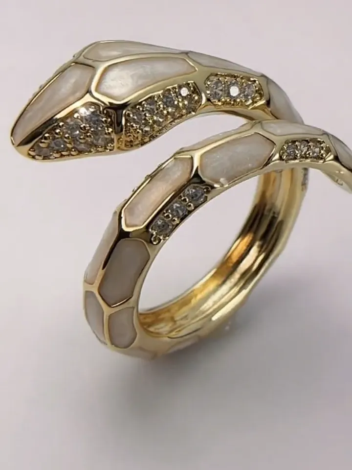 Snake ring with zircons and pearl enamel, gold, one size fits all