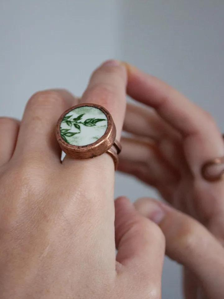 Unique handmade porcelain ring in a copper frame made using the electroforming process