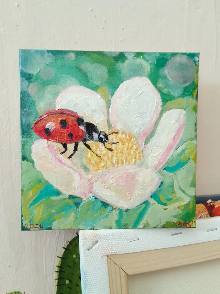 Painting flowers with a Ladybug