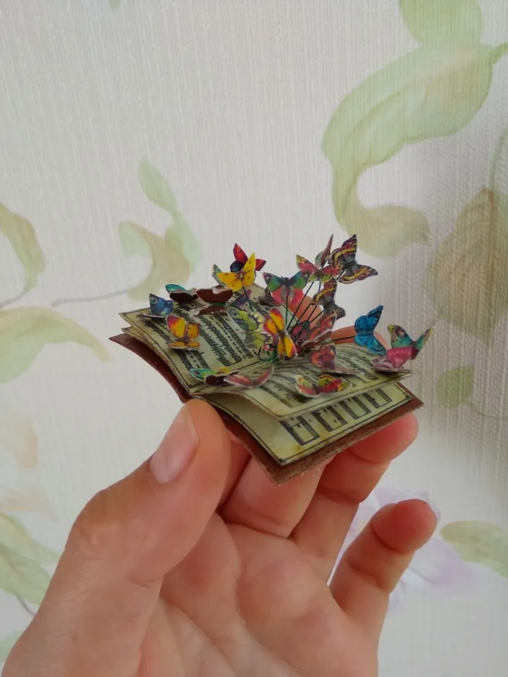 Miniature book with flying butterflies.1:12 scale.