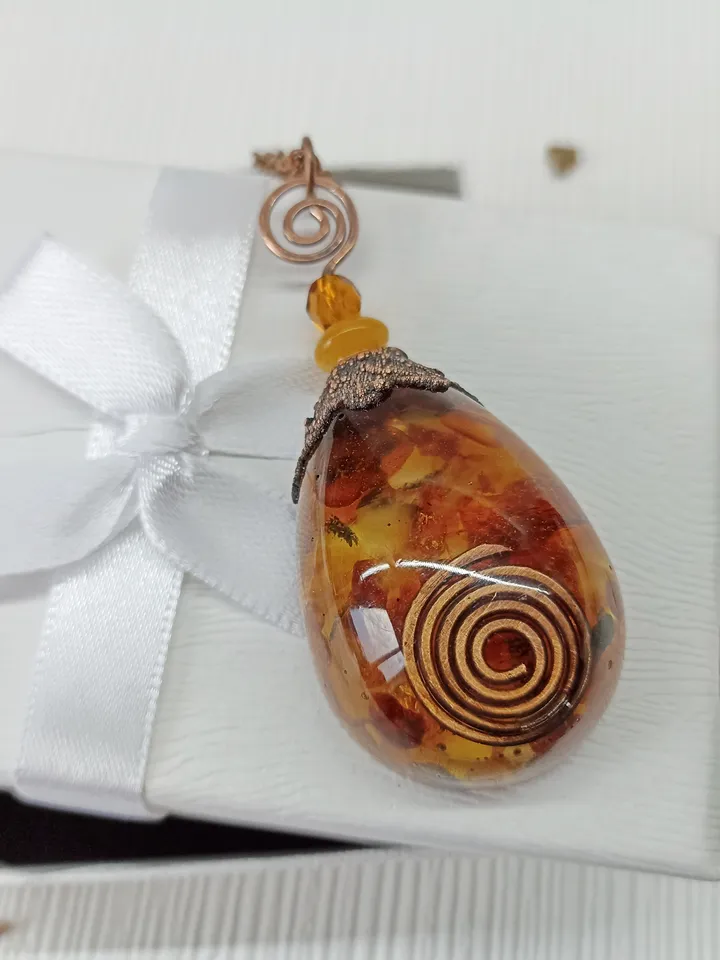 Amber Orgone pendant necklace. Raw Baltic amber chips and a copper spiral in clear eco resin powerful protection necklace generating Orgone energy