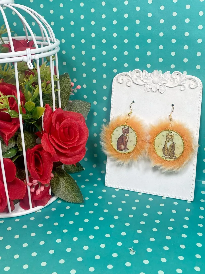 Cute handmade earrings. Image of cats, fur trim.