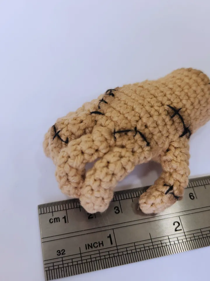 Thing crochet pattern from Wednesday -Photo tutorial of small hand from Wednesday with a heart