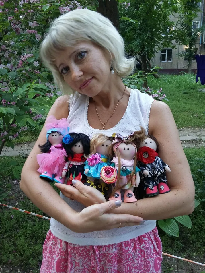 Doll Princess in the crown with an elephant in her hands, with yellow hair, beautiful, interior, birthday present, holiday