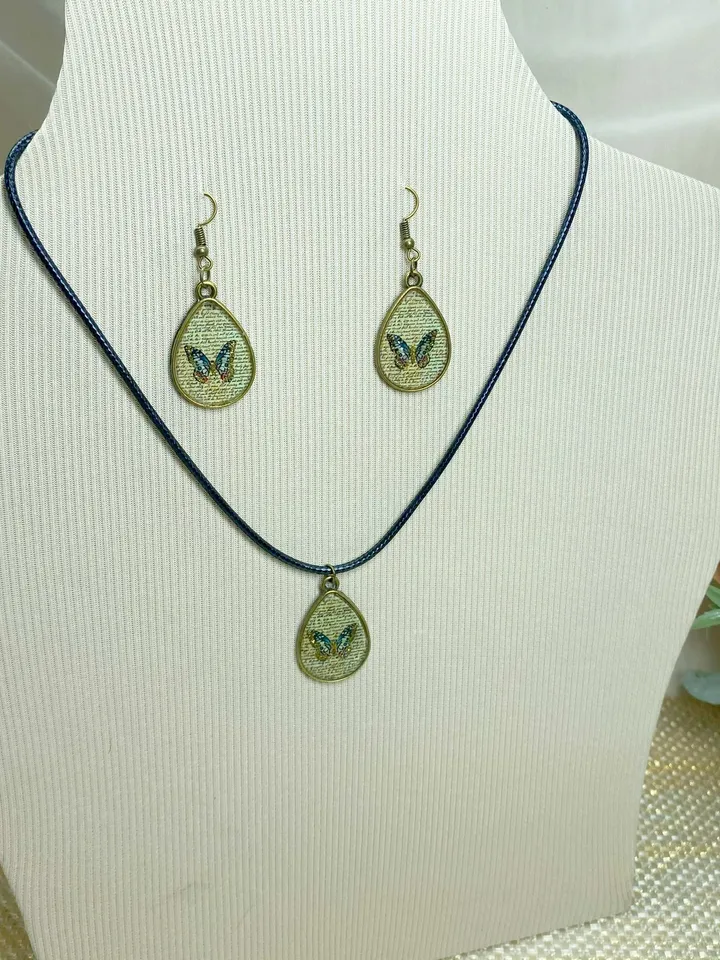 Handmade jewelry set. Shiny butterflies in a bronze frame. designer jewelry.